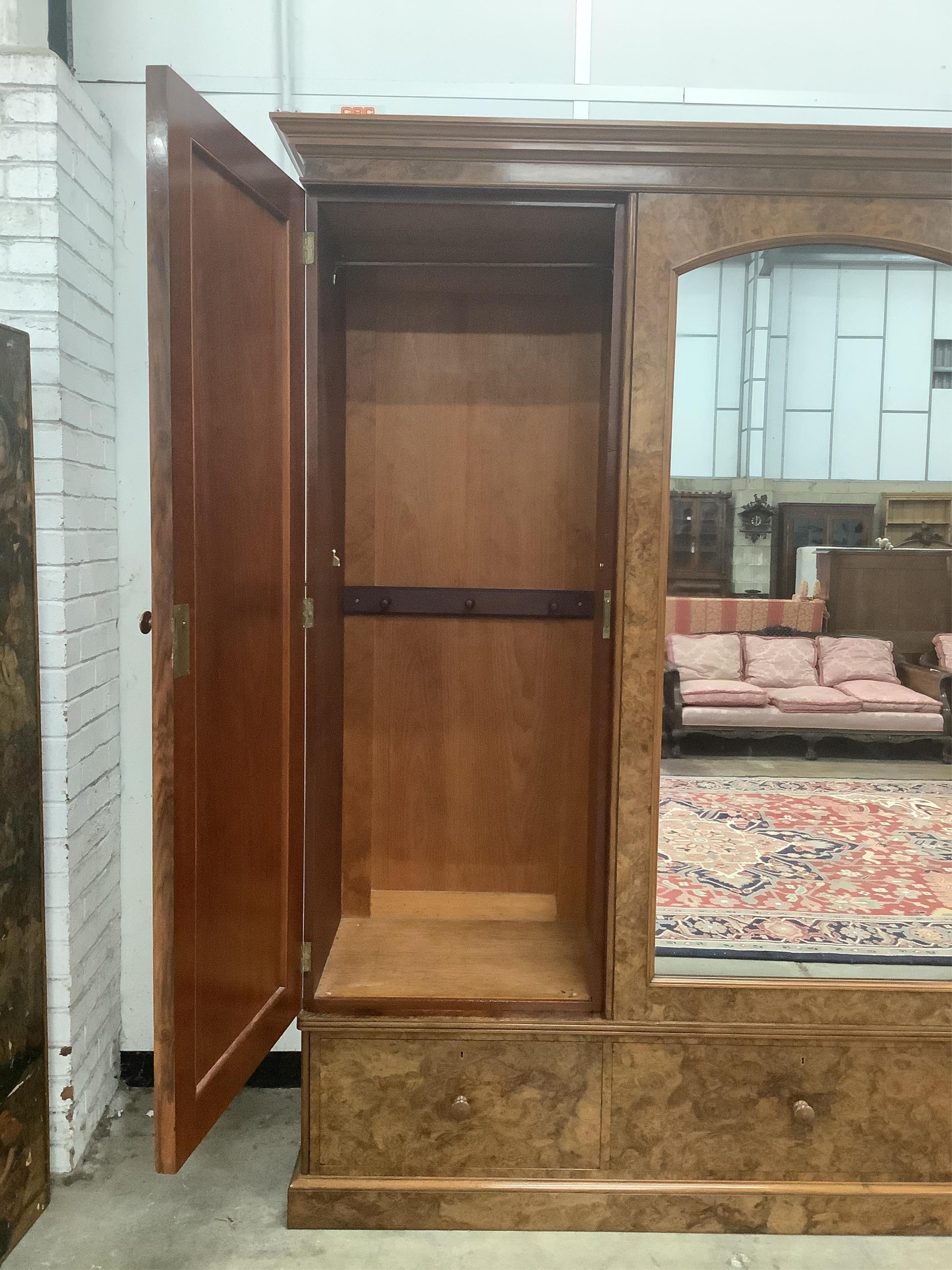 Holland & Sons, a Victorian burr walnut triple mirrored compactum wardrobe, width 225cm, depth 62cm, height 228cm. Condition - good